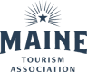 Logo of the Maine Tourism Association featuring the word "MAINE" and a stylized sunburst.